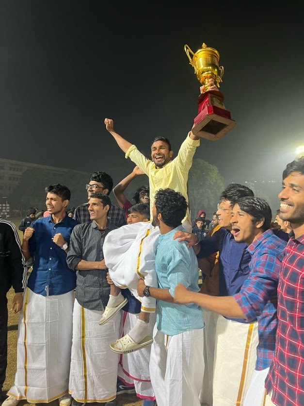Athletics team trophy celebration